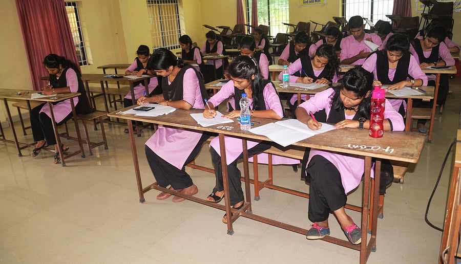 Students of Crossland College, Brahmavar, write a college examination without an invigilator.