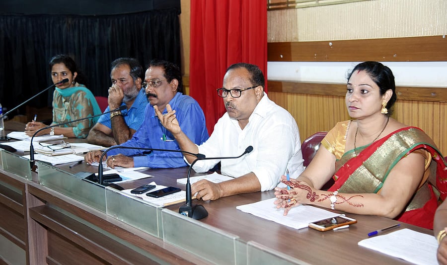 Mangaluru Taluk Panchayat President Mohammed Monu speaks at the Taluk Panchayat general meeting at the Zilla Panchayat Hall in Mangaluru. Panchayat Vice President Poornima Ganesh and Mangaluru Tahsildar Guruprasad look on.