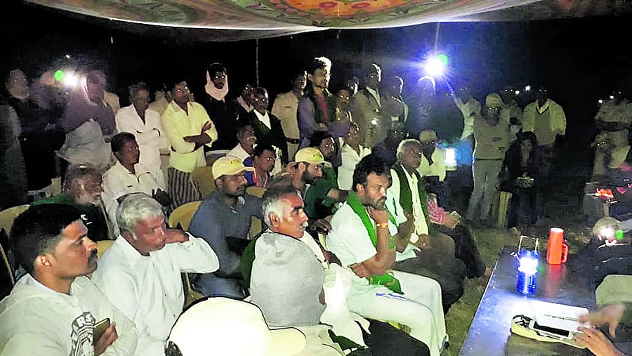 Residents of Changadi village discuss with DFO Yedukondalu at a meeting in the village, under MM Hills, Chamarajanagar district.