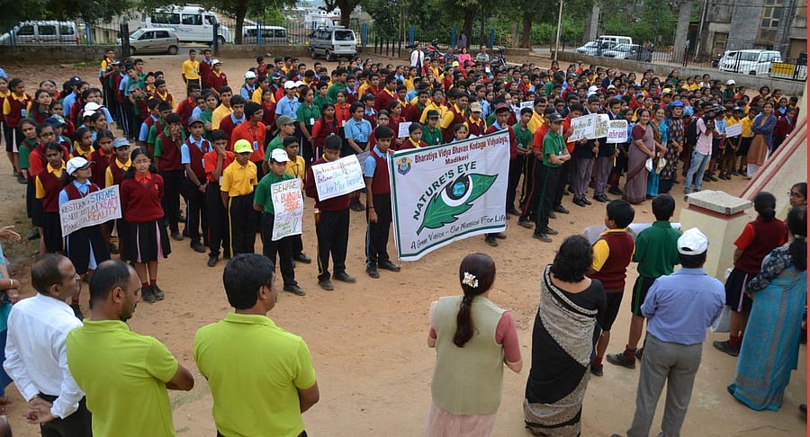 Students take part in a cleanliness jatha in Madikeri.