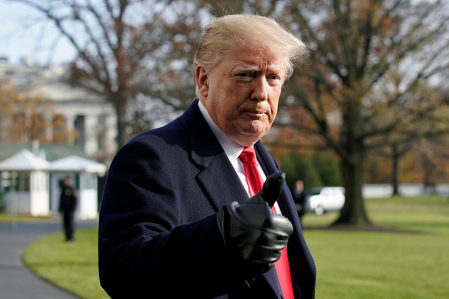 U.S. President Donald Trump thumbs up to the media on the South Lawn of the White House in Washington before his departure for the annual Army-Navy college football game in Philadelphia, U.S., December 8, 2018. REUTERS/Yuri Gripas
