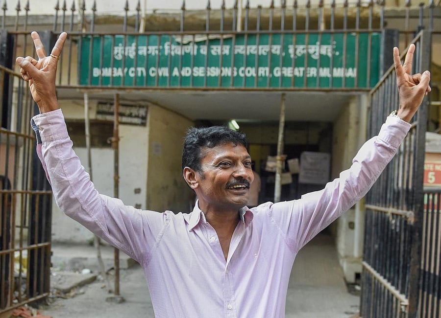 Rajendra Jeerawala, owner of a farm house in Gujarat who, according to CBI, facilitated the illegal detention, leaves the special CBI court after he was acquitted, in Mumbai, Friday, Dec. 21, 2018. The court has acquitted all 22 accused in the alleged fak
