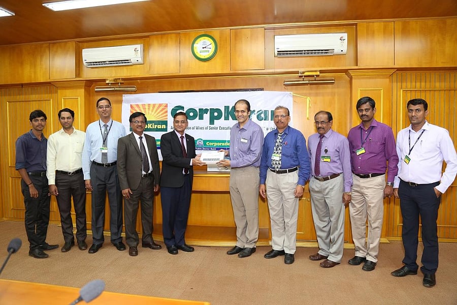 Jai Kumar Garg, Managing Director and CEO, Corporation Bank handing over the ECG machines to Dr Padmanabh Kamath, Interventional Cardiologist, KMC, Hospital, Mangaluru.