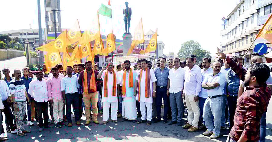 Bajrang Dal workers celebrate the airstrike by the Indian Air Force on a terror base in LoC at General Thimayya Circle in Madikeri on Tuesday.