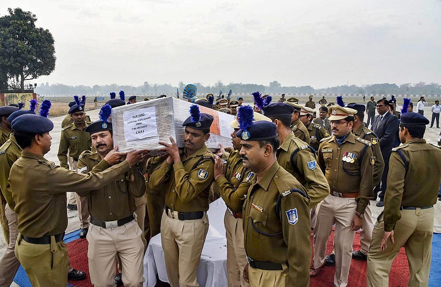 CRPF personnel carry the mortal remains of inspector Pintu Kumar Singh, who was killed in an encounter with militants at north Kashmir's frontier Kupwara district, after a wreath-laying ceremony, in Patna. (PTI Photo)