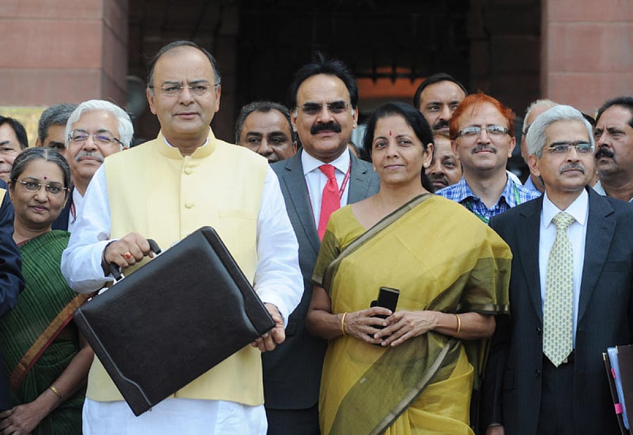 The Union Minister for Finance, Corporate Affairs and Defence, Shri Arun Jaitley departs from North Block to Parliament House along with the Minister of State for Commerce & Industry (Independent Charge), Finance and Corporate Affairs, Smt. Nirmala Sitharaman. (PTI Photo)