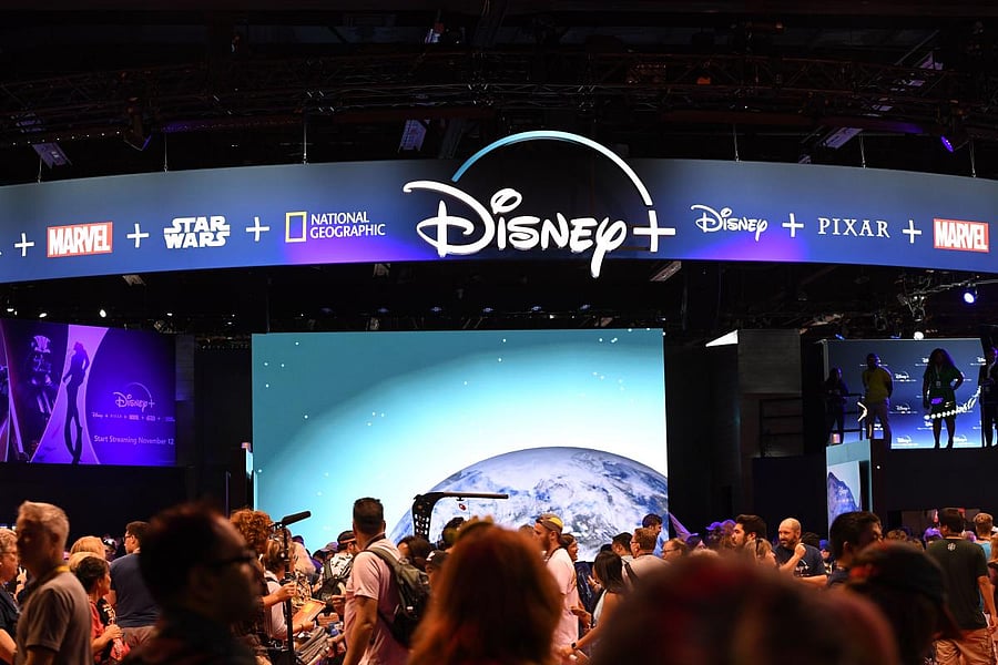 Attendees visit the Disney+ streaming service booth at the D23 Expo, billed as the "largest Disney fan event in the world," at the Anaheim Convention Center in Anaheim, California