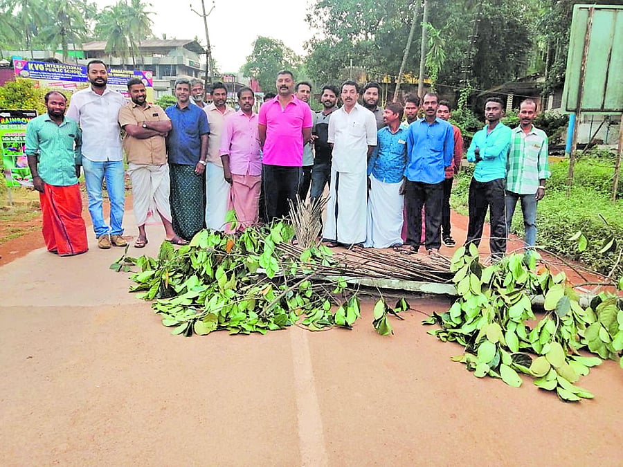 Villagers of Karike block Karike-Bhagamandala Road in protest on Wednesday.