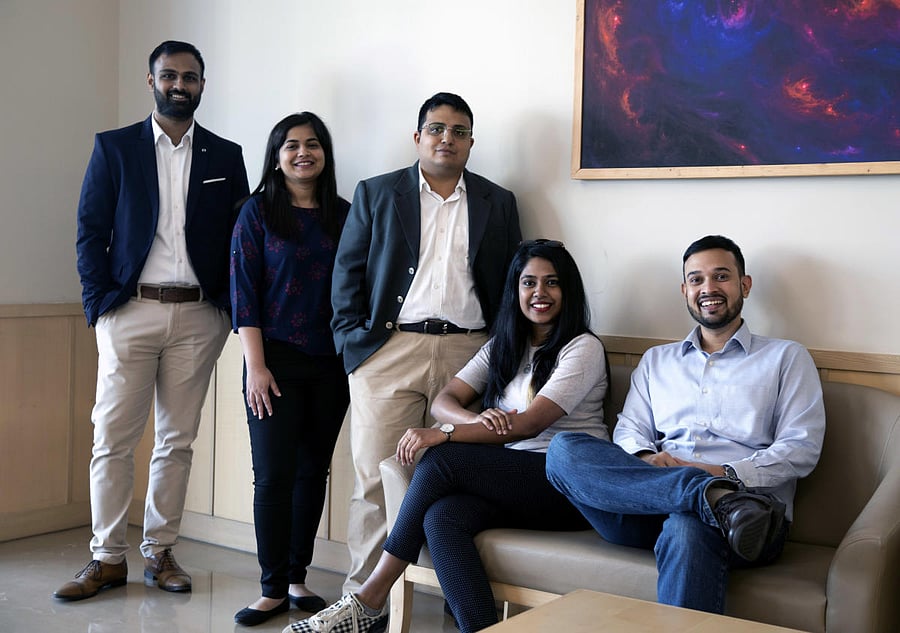 Deepak Menon (centre) with Village Capital team