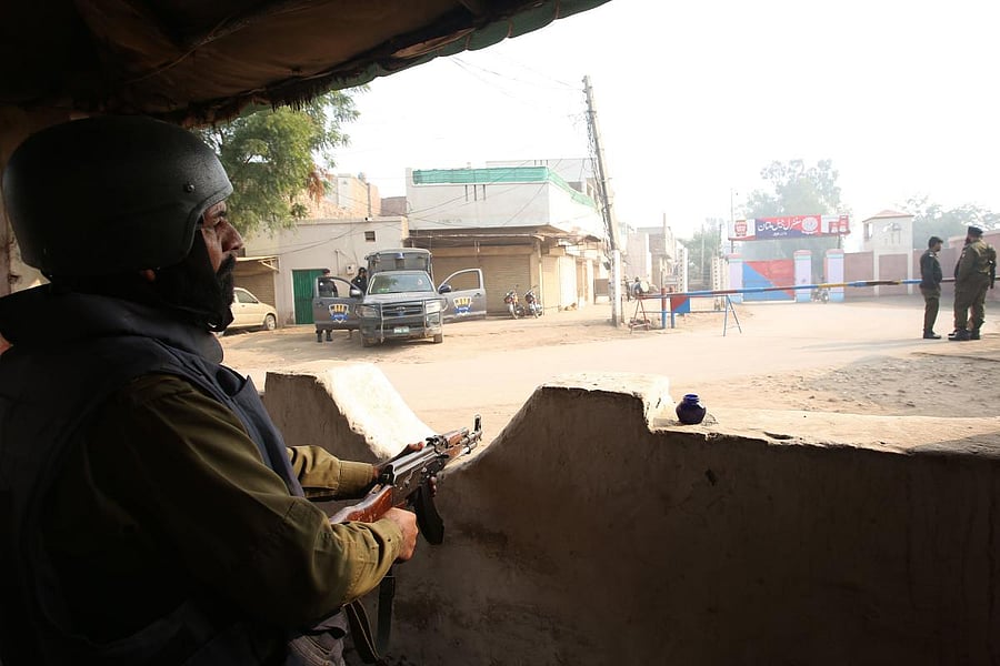 A policeman keeps watch outside the central jail, as the court delivered the verdict on a blasphemy case, in Multan (AFP Photo)