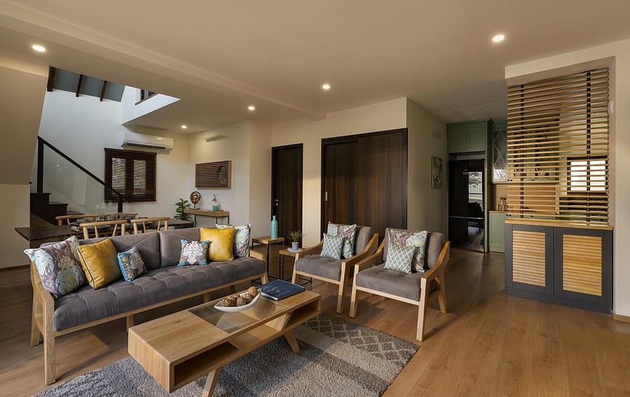 The interior of the living room of the North American style wood frame construction house on the premises of Pyramid Timber Associates, Yelwal, Hunsur Road, in Mysuru. (DH Photo)
