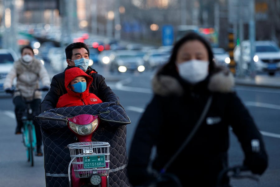 People wear masks as they ride vehicles during evening rush hour, as the country is hit by an outbreak of the novel coronavirus, in Beijing, China, March 3, 2020. (Reuters Photo)