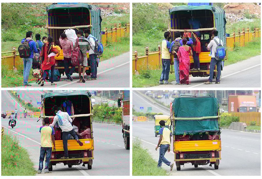 Migrant workers board a goods auto on the Bangalore-Hyderabad highway on Thursday and cover up to avoid detection by the police. DH Photo/Pushkar V