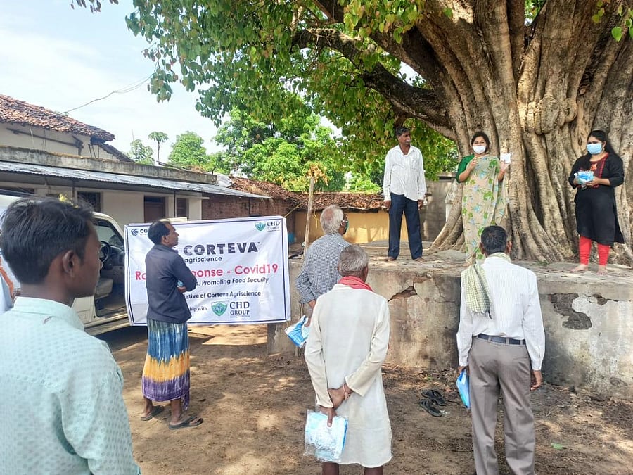 CHD group members create awareness among farmers on Covid-19.