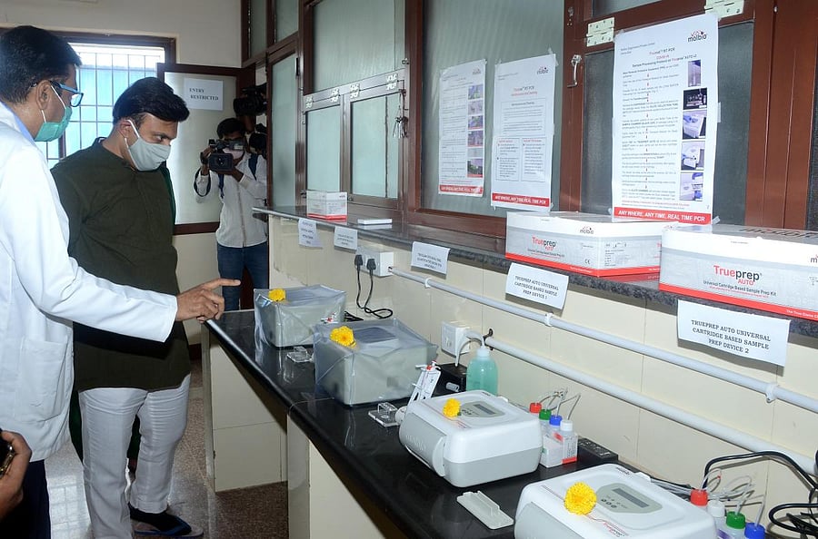 Minister for Medical Education Dr K Sudhakar launches TrueNat machines for Covid-19 testing, at the district hospital in Chikkaballapur on Saturday. DH Photo