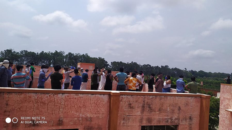 Complaining about the facilities, the returnees protested on the roof of the hostel and beamed it live on Facebook.