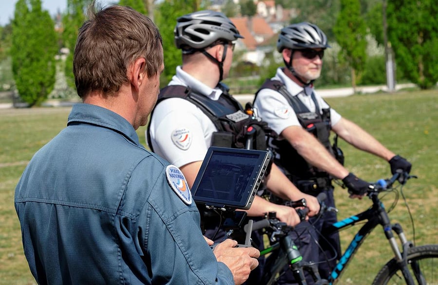 A border police officer, assisted by two police officers, makes a demonstration of a surveillance drone used to ensure the enforcement of the lockdown. AFP/Representative image