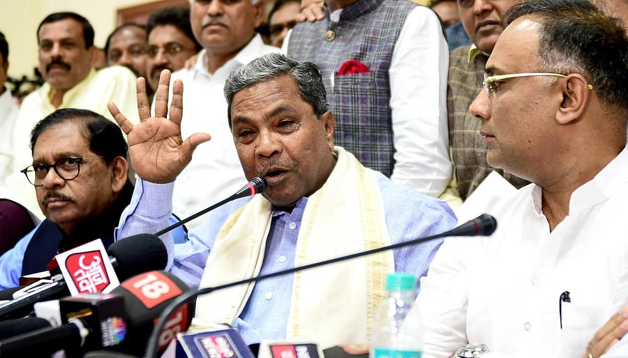 Congress Legislature Party (CLP) leader Siddaramaiah, Deputy Chief Minister G Parameshwara and Karnataka Pradesh Congress Committee (KPCC) president Dinesh Gundu Rao submitted the petition, which runs into nearly 100 pages, to Kumar at his chamber in Vidhana Soudha. DH File Photo
