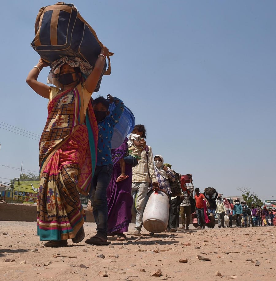 Migrant workers wait in a queue in Uttar Pradesh (PTI Photo)
