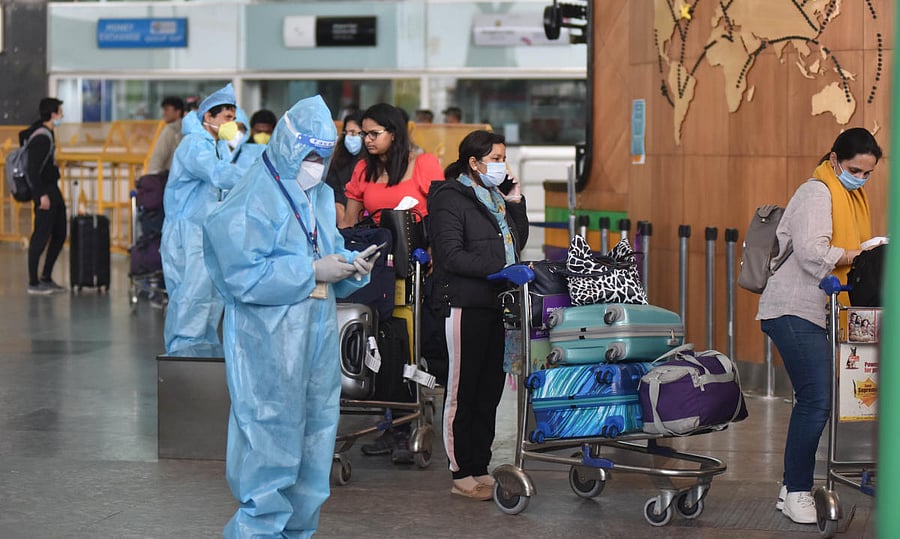 Passengers from the flight, Air India (AI 1803) coming from London, after landed Kempegowda International Airport went to 14 days quarantine at a bus, in Bengaluru on Monday early morning 11 May, 2020. Photo by Janardhan B K