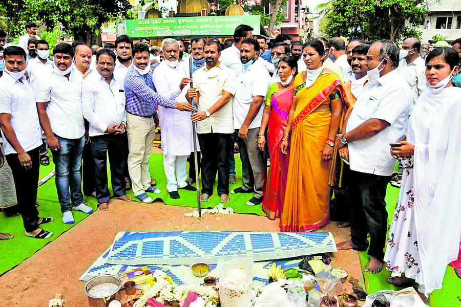District In-charge Minister S T Somashekar lays foundation stone for a road development work at Hebbal, Vijayanagar in Mysuru on Friday. MLA L Nagendra and corporator Prema Shankaregowda are seen.