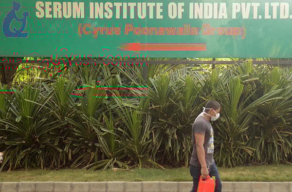 A man walks past a signpost of India's Serum Institute, the world's largest maker of vaccines, which is developing a vaccine against the coronavirus disease (COVID-19) at its laboratory in Pune, India, May 18, 2020. (Credit: Reuters Photo)