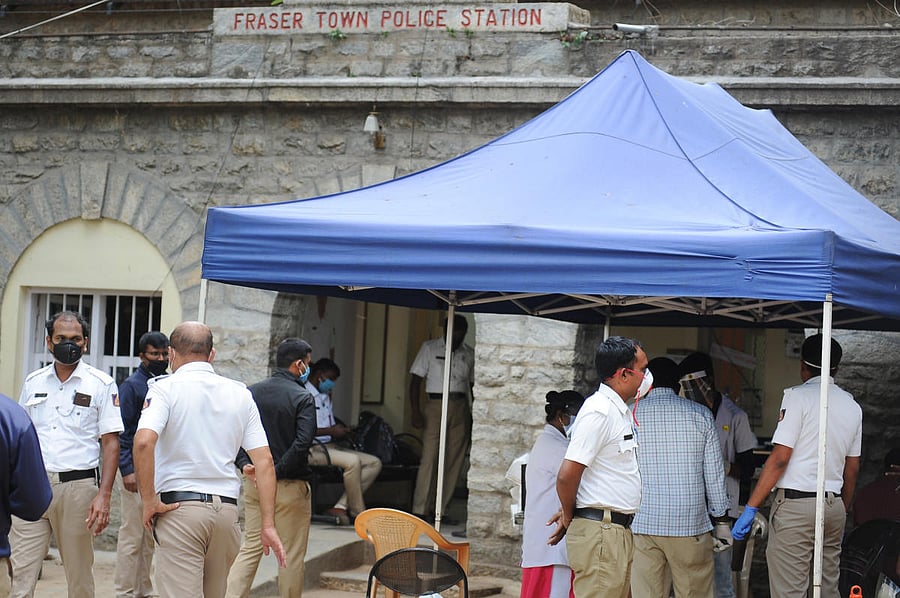 Policemen undergo a medical checkup at the Pulakeshinagar traffic police station on Friday. DH Photo/Pushkar V