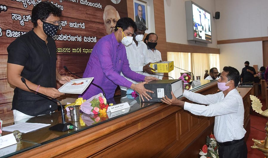 MP Nalin Kumar Kateel hands over equipment for digi learn smart class app, at a programme held at MCC Hall, in Mangaluru.