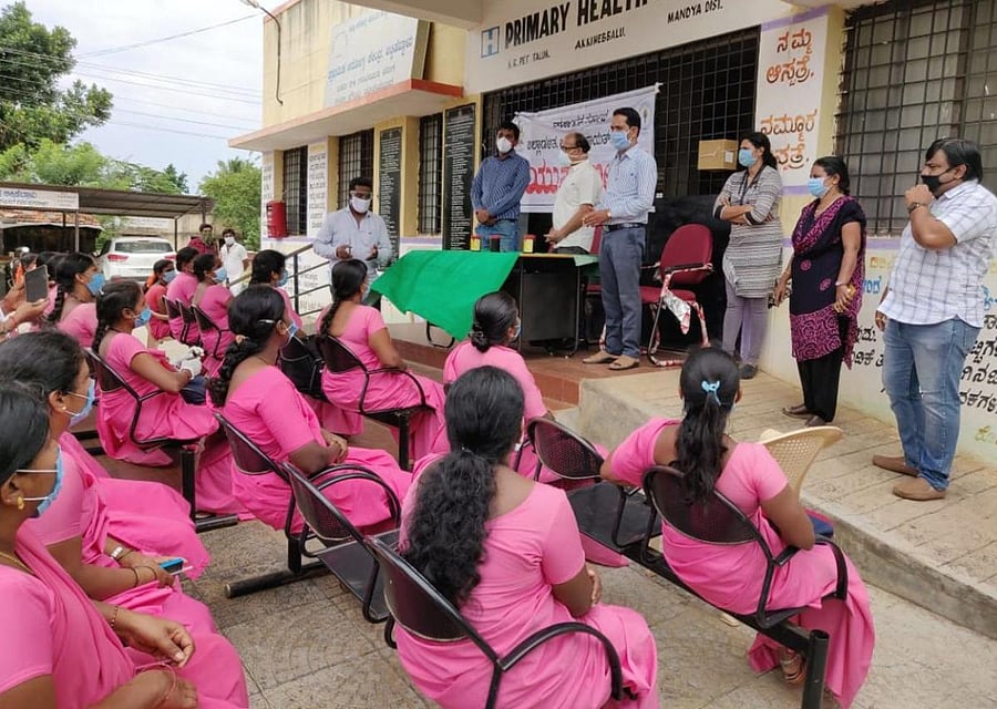 Anganwadi workers attend a training on Covid-19 at a primary h ealth centre in KR Pet taluk of Mandya district on Saturday. DH Photo