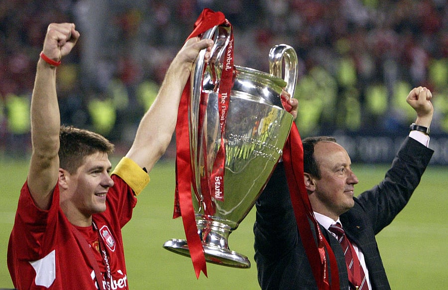 In this file AFP photo taken on May 25, 2005, Liverpool's captain Steven Gerrard holds the throphy with Liverpool's Spanish Manager Rafael Benitez at the end of the UEFA Champions league football final AC Milan vs Liverpool, at the Ataturk Stadium in Istanbul.