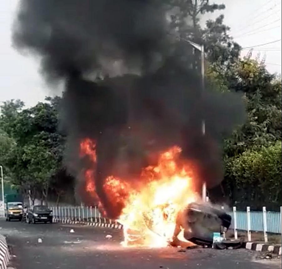 The car went up in flames after it hit a median and toppled at New BEL Road on Sunday. Special arrangement