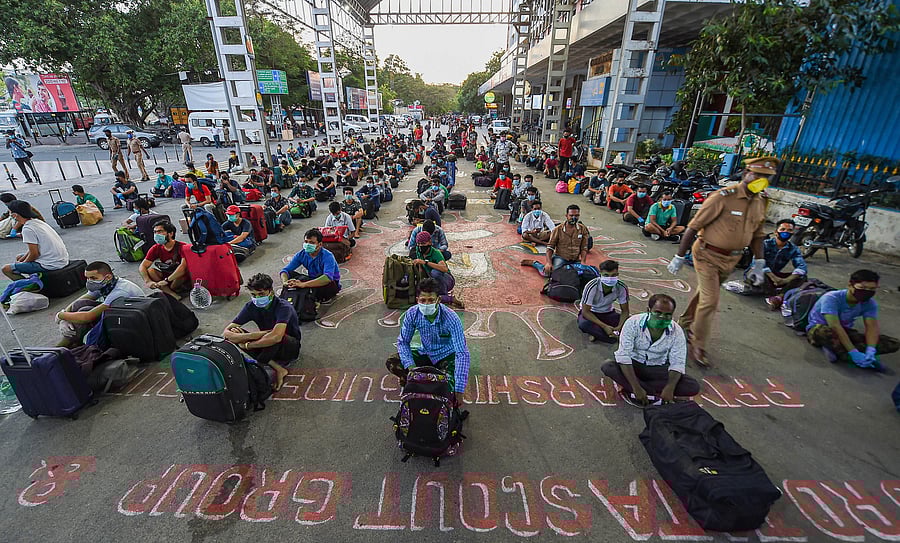 Migrants waiting in queues to board trains to Assam and Meghalaya from Central Railway Station. (PTI Photo)