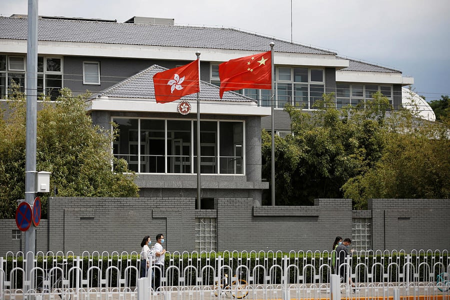 Chinese and Hong Kong flags at the office of the Government of the Hong Kong Special Administrative Region in Beijing, China. (REUTERS Photo)