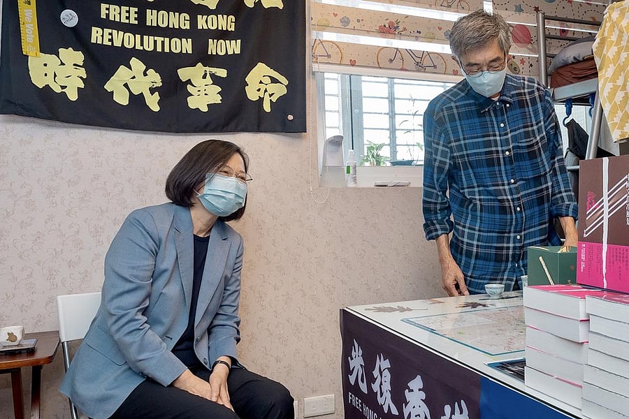 Taiwan President Tsai Ing-wen speaks while visiting Lam Wing-kee (R), a bookseller from Hong Kong who in 2015 was detained in China for allegedly bringing banned books into the mainland, at ‘Causeway Bay Books' bookstore in Taipei. AFP/Taiwan’s Presidential Office