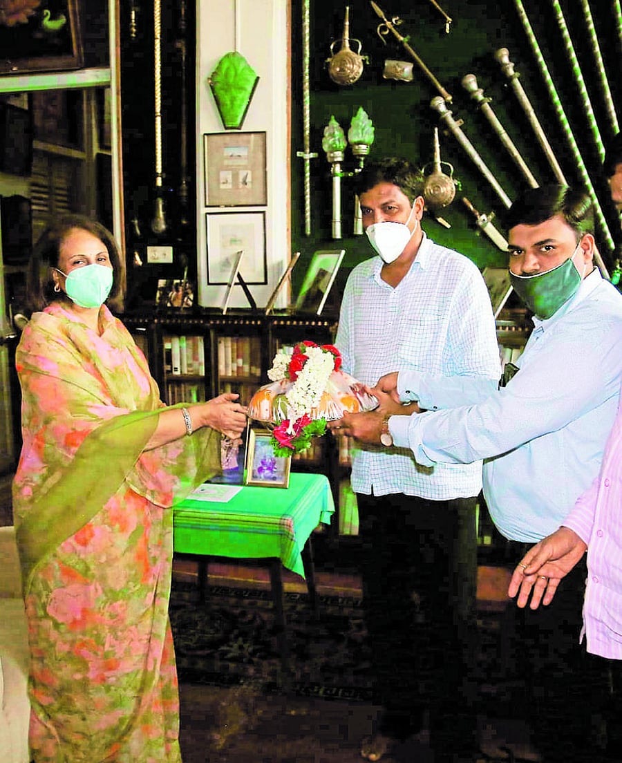 Water Resources Minister Ramesh Jarkiholi greets Rajamatha Pramoda Devi Wadiyar at the Palace in Mysuru on Friday.