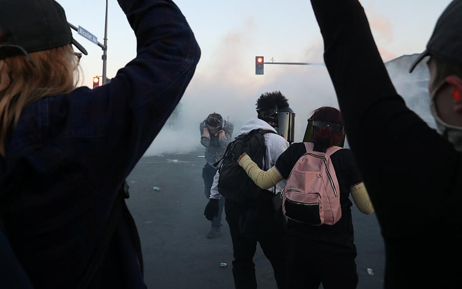 People react to tear gas as protesters continue to rally against the death in Minneapolis police custody of George Floyd, in Minneapolis, Minnesota. Reuters