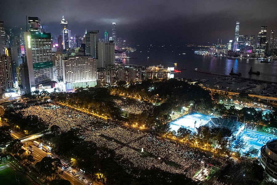 This file photo taken on June 4, 2019 shows people attending a candlelight vigil at Victoria Park in Hong Kong, to mark the 30th anniversary of the 1989 Tiananmen crackdown in Beijing. AFP