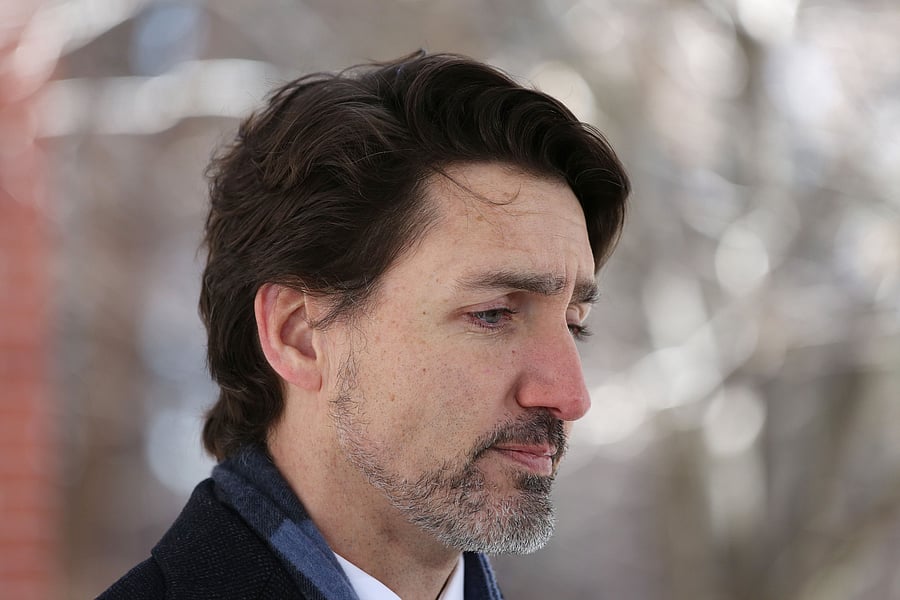 He also cautioned against drawing comparisons between Canada and the United States, or concluding "that we are much better here." (Credit: AFP Photo)