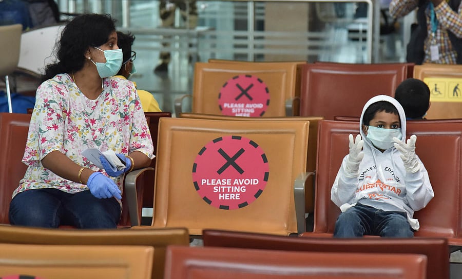 Middle seats in the airport terminal have been marked thus. DH PHOTO/JANARDHAN B K