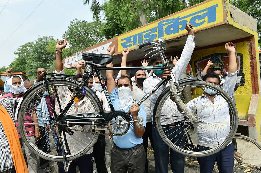  Workers shout slogans during a protest outside the factory after the manufacturers of famous Atlas Cycles shut their operations due to financial constraints on Wednesday, in Ghaziabad, Thursday, June 4, 2020. The company was facing financial crisis from the past many years even after the closure of its Malanpur unit but with the shutting of the Sahibabad unit, it has closed down its last factory. Credit: PTI Photo