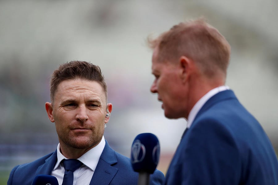 Brendon McCullum and Shaun Pollock perform media duties pitchside before a match. Reuters/File