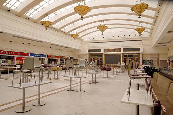 Chairs are seen lying on tables at a mall ahead of its reopening during an extended nationwide lockdown to slow down the spread of the coronavirus disease (COVID-19), in New Delhi. Credit: Reuters Photo