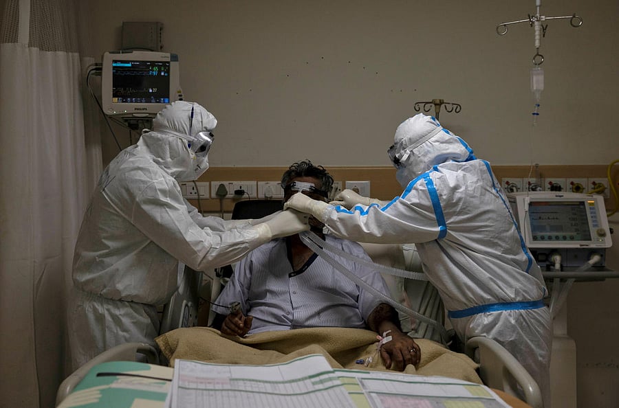  Medical workers wearing personal protective equipment (PPE) take care of a patient suffering from the coronavirus disease (COVID-19), at the Intensive Care Unit (ICU) of the Max Smart Super Speciality Hospital in New Delhi, India, May 28, 2020. Credit/Reuters Photo