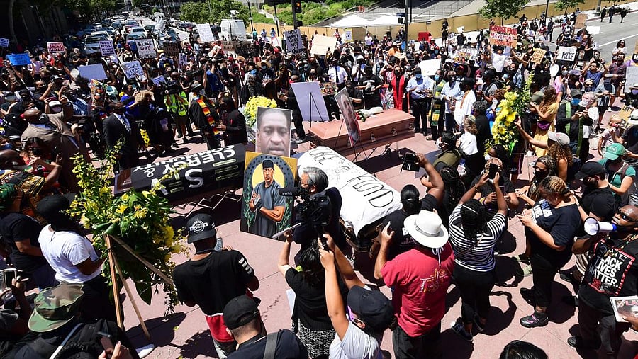 Interfaith leaders and others gather for a memorial service honoring George Floyd and demanding justice for those killed at the hands of the police in downtown Los Angeles, California. AFP