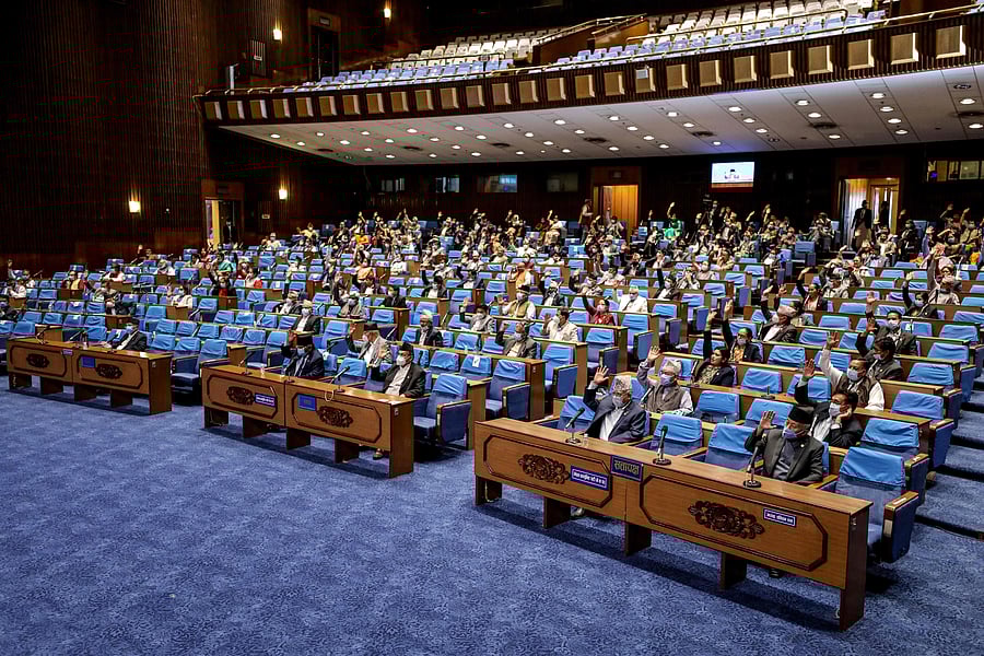 Nepal's House of Representatives members gesture as they vote on an amendment to update the national emblem with a new controversial political map in Kathmandu on June 13, 2020. Credit: AFP Photo