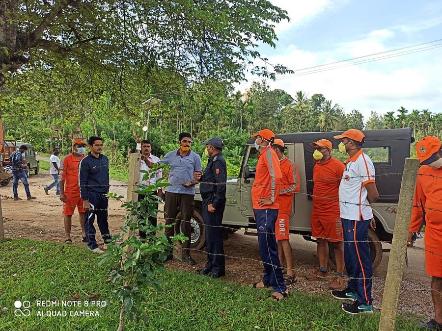 NDRF team inspects a vulnerable region in Kodagu. DH Photo