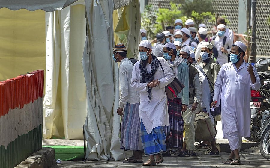  People who came for ‘Jamat’, a religious gathering at Nizamuddin Mosque, being taken to LNJP hospital for COVID-19 test, after several people showed symptoms of coronavirus, during a nationwide lockdown, in New Delhi, Tuesday, March 31, 2020. Credit/PTI Photo