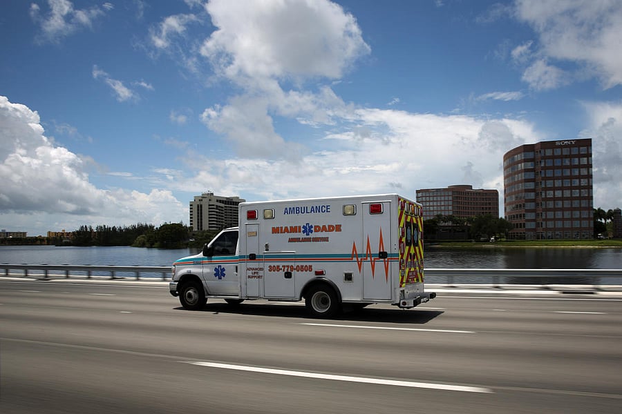 An ambulance is seen in a main highway, as Miami-Dade County eases some of the lockdown measures put in place during the coronavirus disease outbreak, in Miami. Reuters