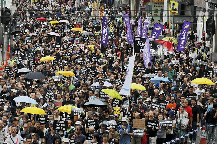Protesters march in Hong Kong Sunday, Oct. 1, 2017. Pro-democracy groups held a protest against what they perceive as China‚Äôs authoritarian rule and to demand the Secretary for Justice step down for what they believe is an eroding of the rule of law following new stiffer sentences for student protest leaders. Credit/AP Photo