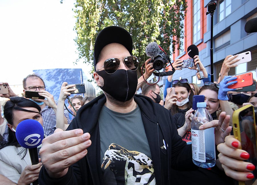 Russian film and theatre director Kirill Serebrennikov wearing a protective face mask, used as a preventive measure against the spread of the coronavirus disease (COVID-19), walks past journalists and supporters near a court building in Moscow, Russia June 26, 2020. A Russian court handed Serebrennikov a three-year suspended sentence after finding him guilty of embezzlement. Credit: REUTERS
